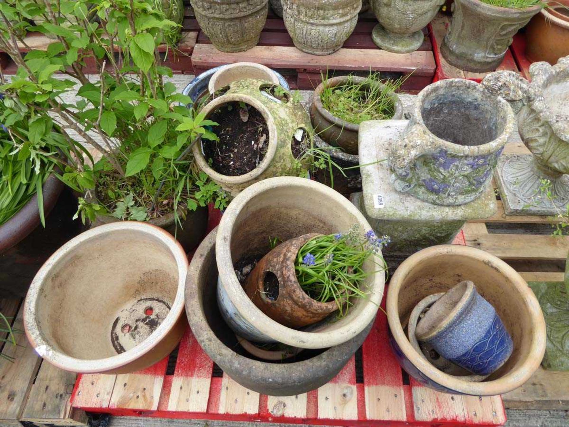 Pallet of assorted pots inc. strawberry planters, concrete plinth etc.