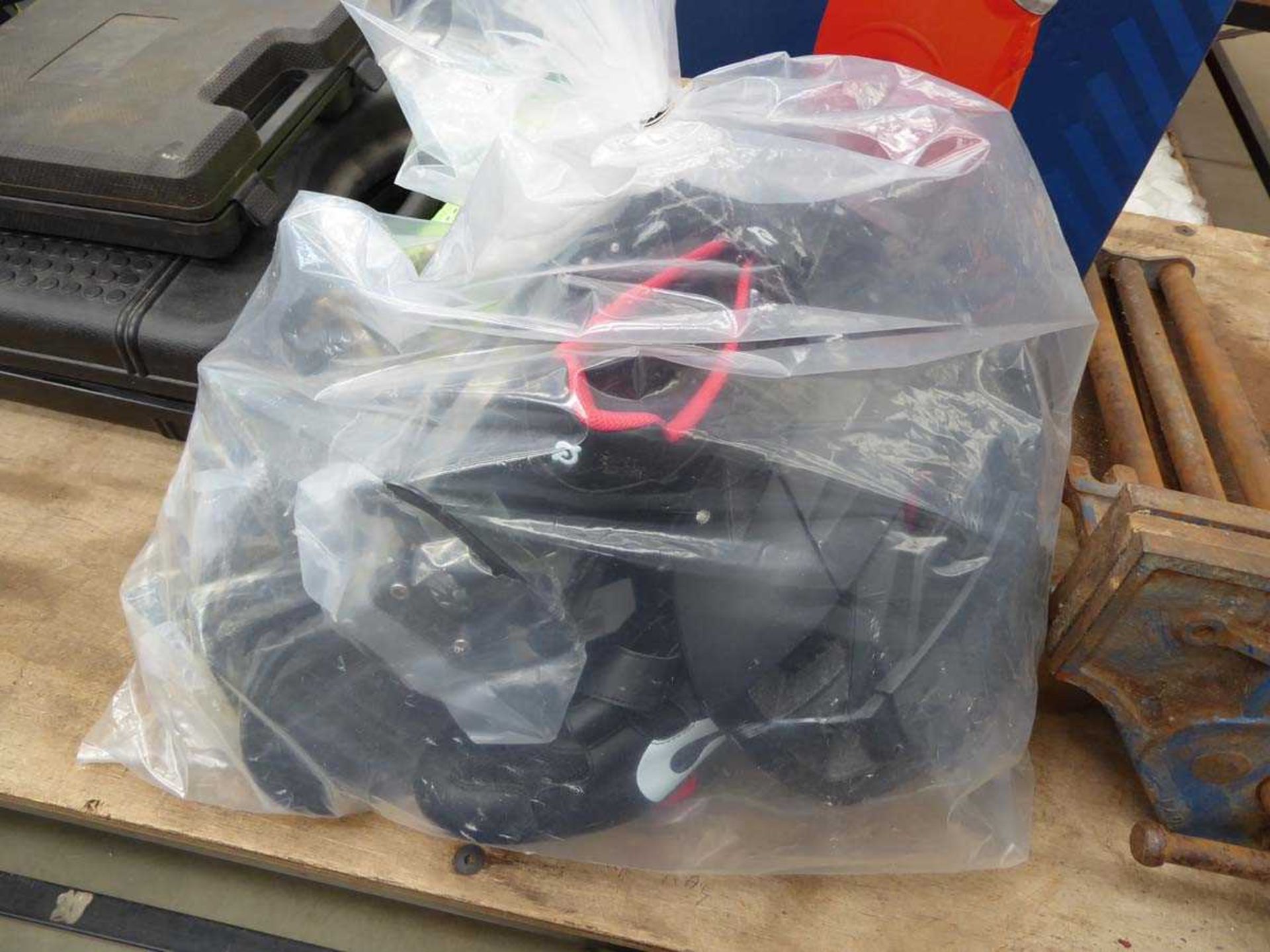 Bag of items inc., cycle shoes, small racks and a helmet