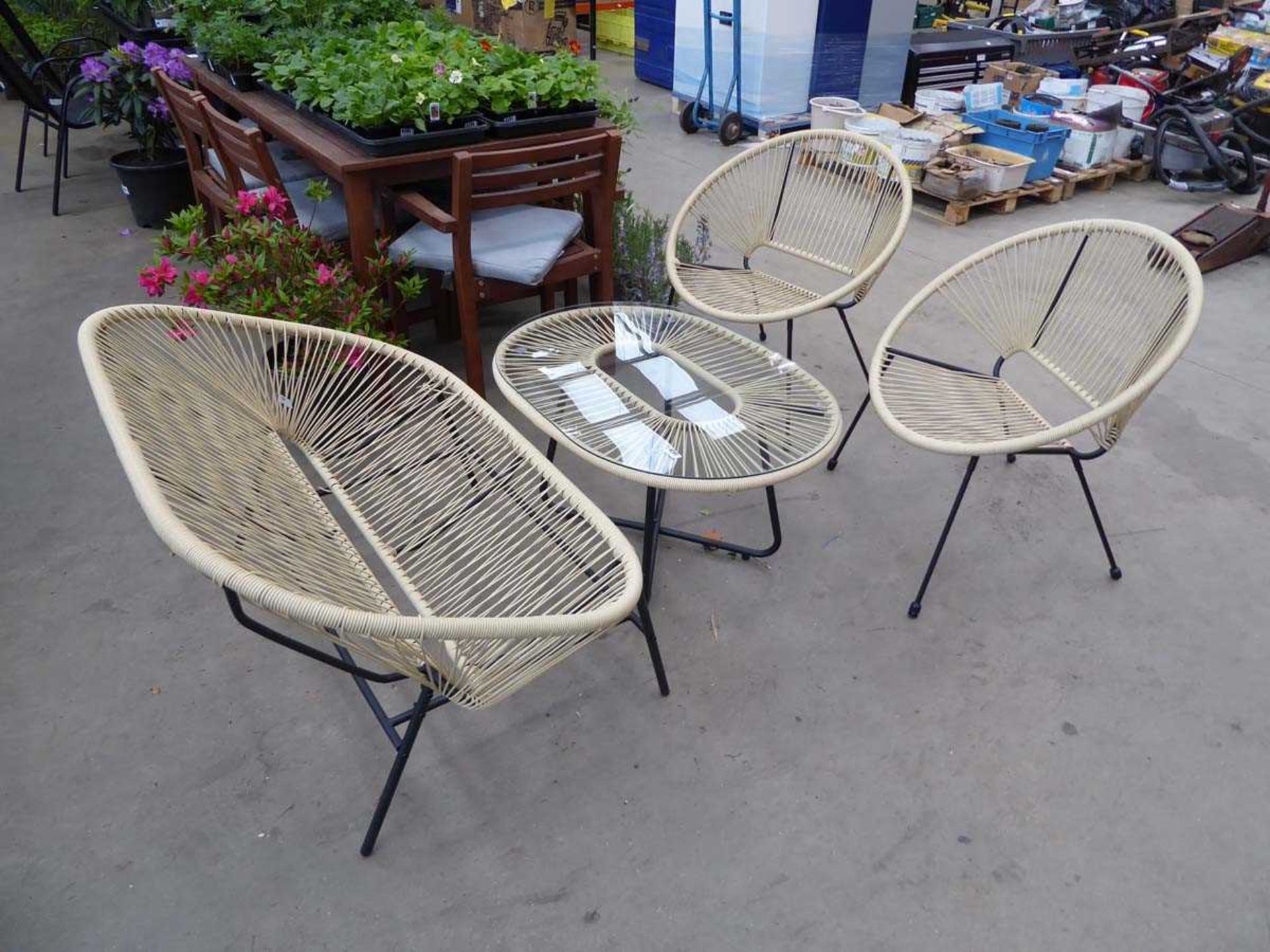 Four piece string garden set comprising two seater bench, two chairs and a glass topped coffee