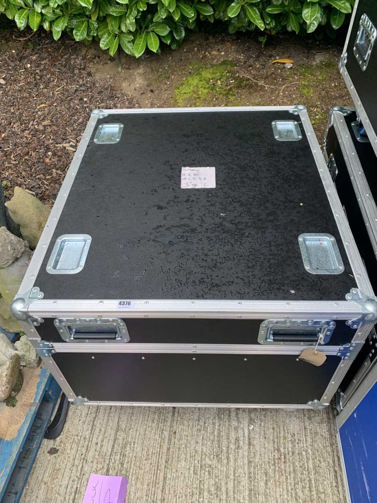 3 black and silver wheeled flight cases