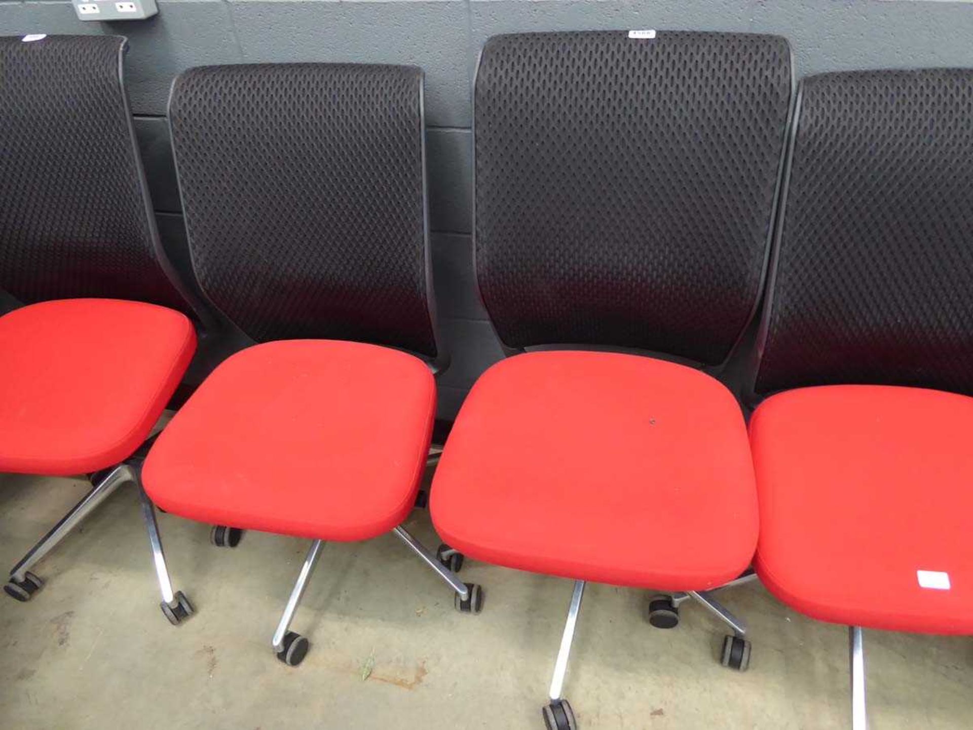 2 red cloth mesh back swivel chairs