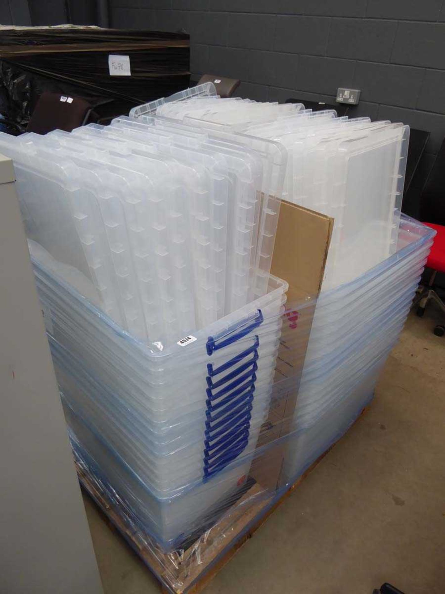 Pallet of plastic storage boxes