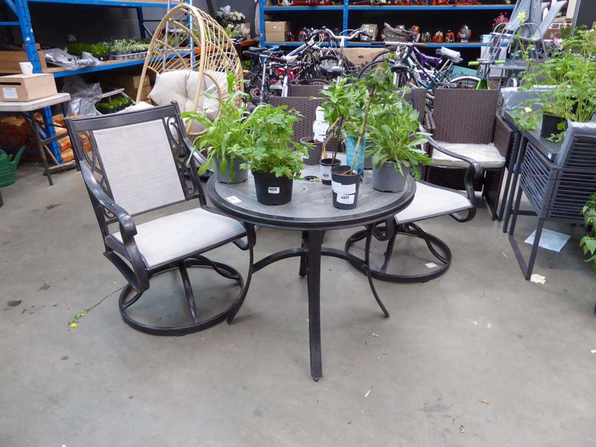 +VAT Round tile topped garden table and two chairs
