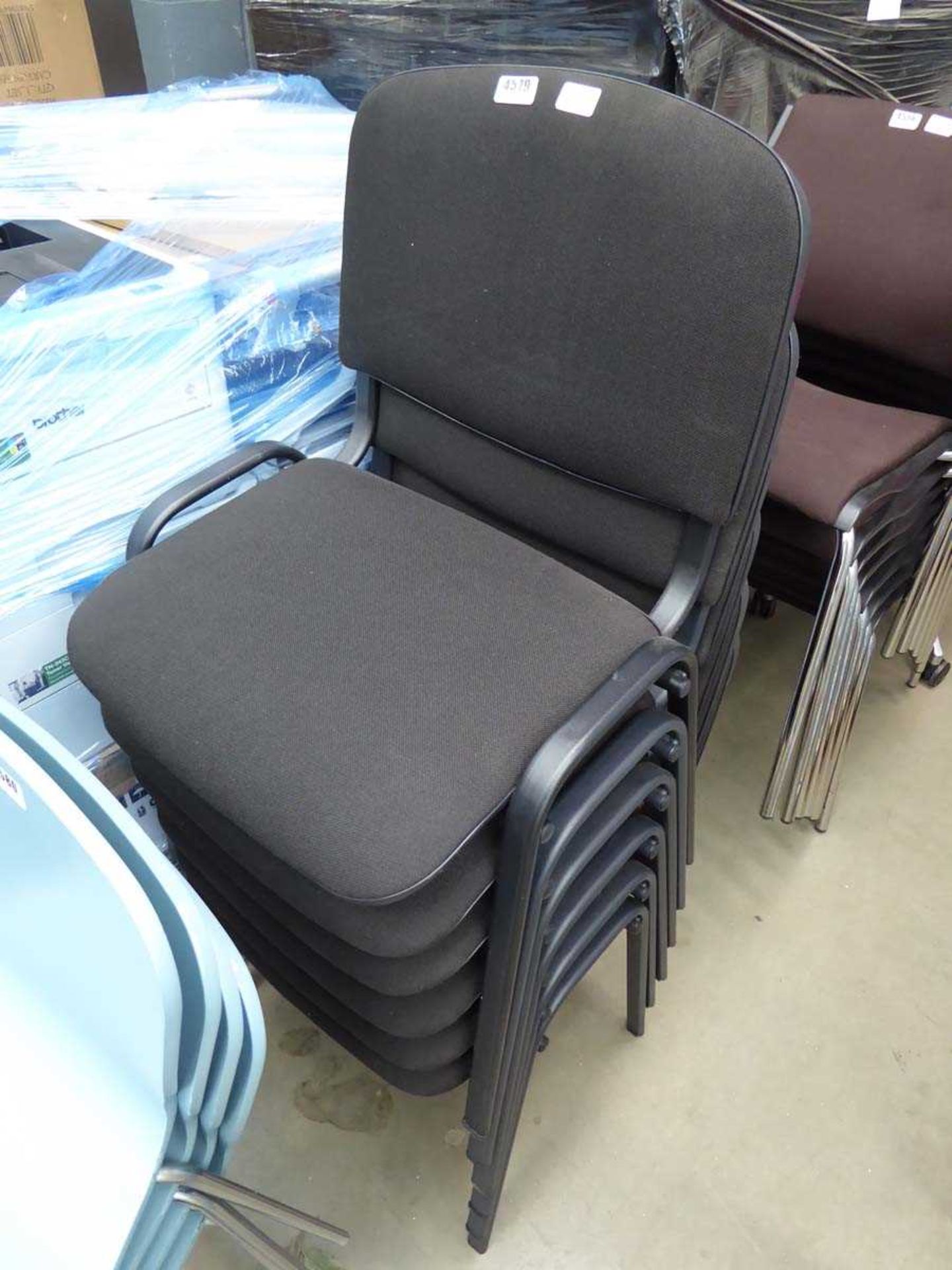 6 black cloth stacking chairs