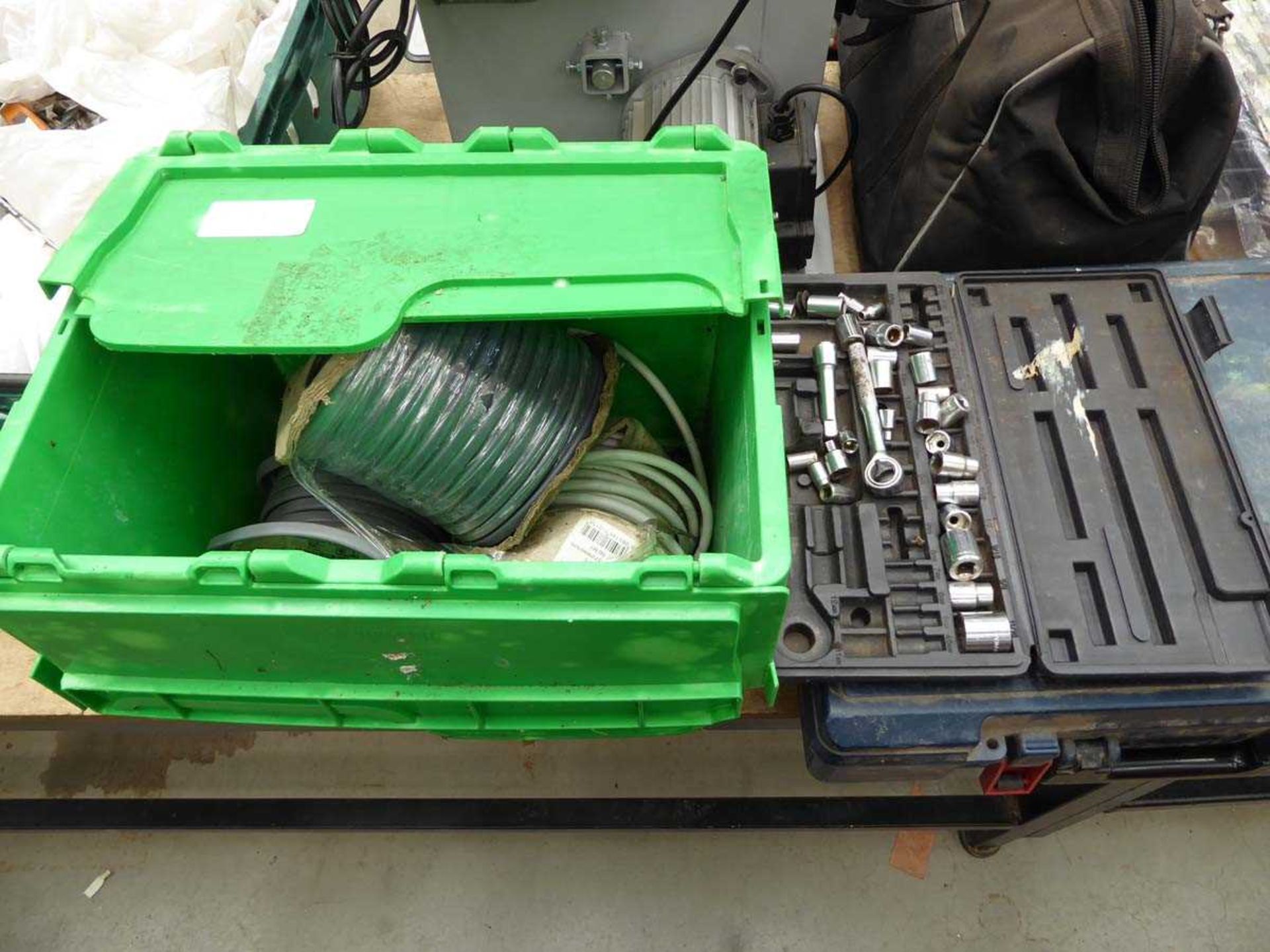 Box containing cable and small socket set