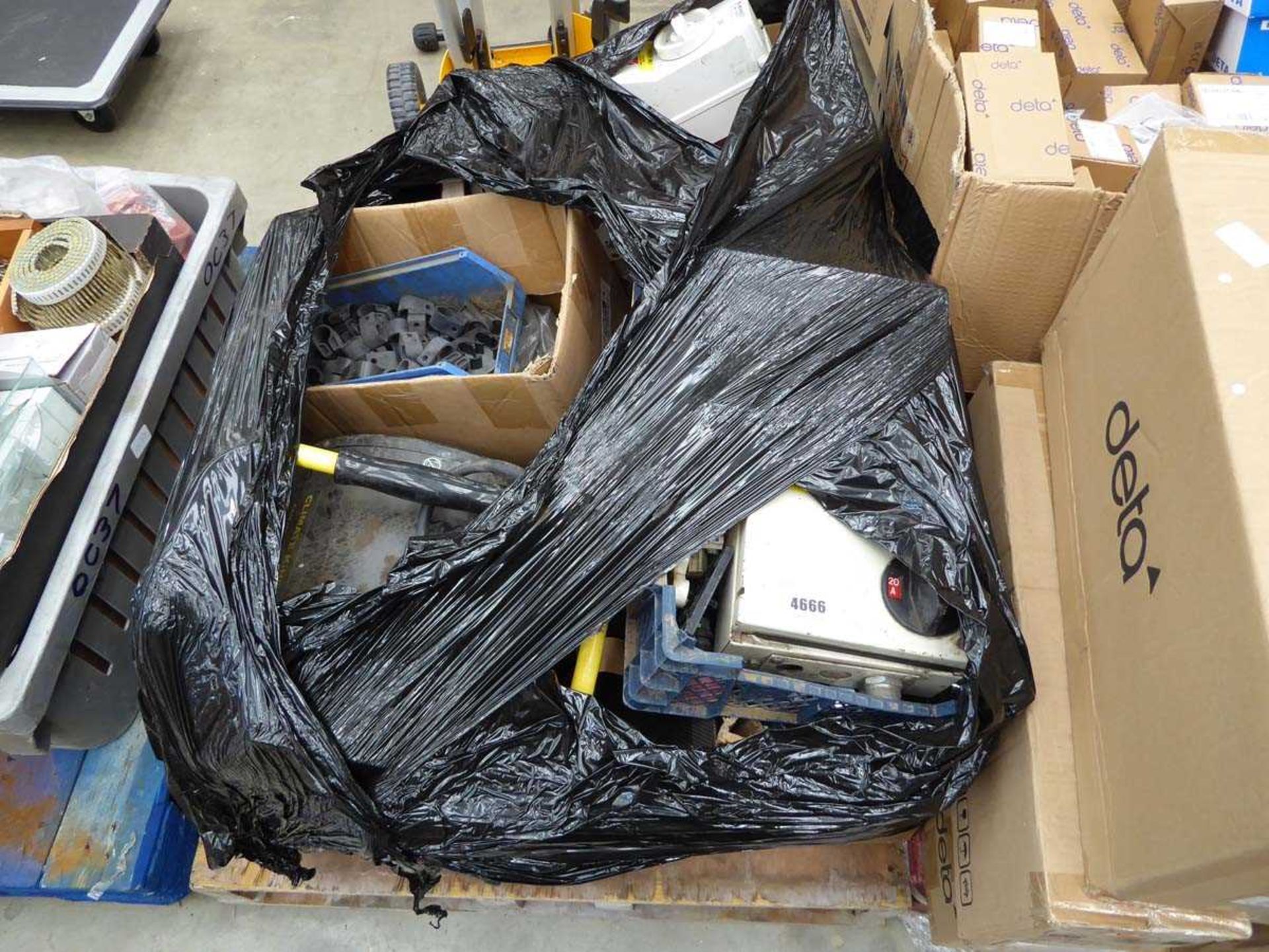 Pallet containing heater, used switches and sockets etc.