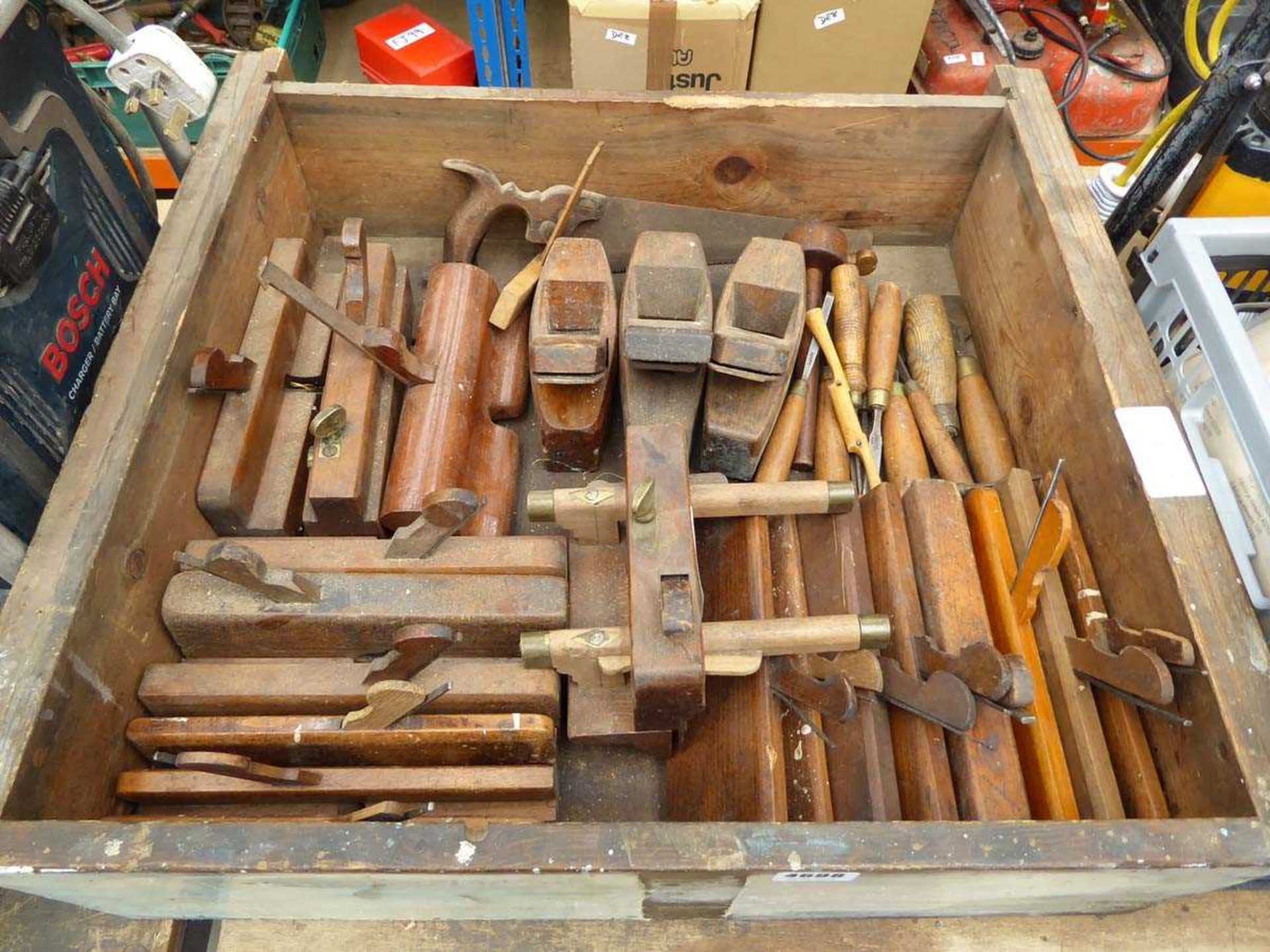 Wooden drawer of vintage wooden planes and chisels