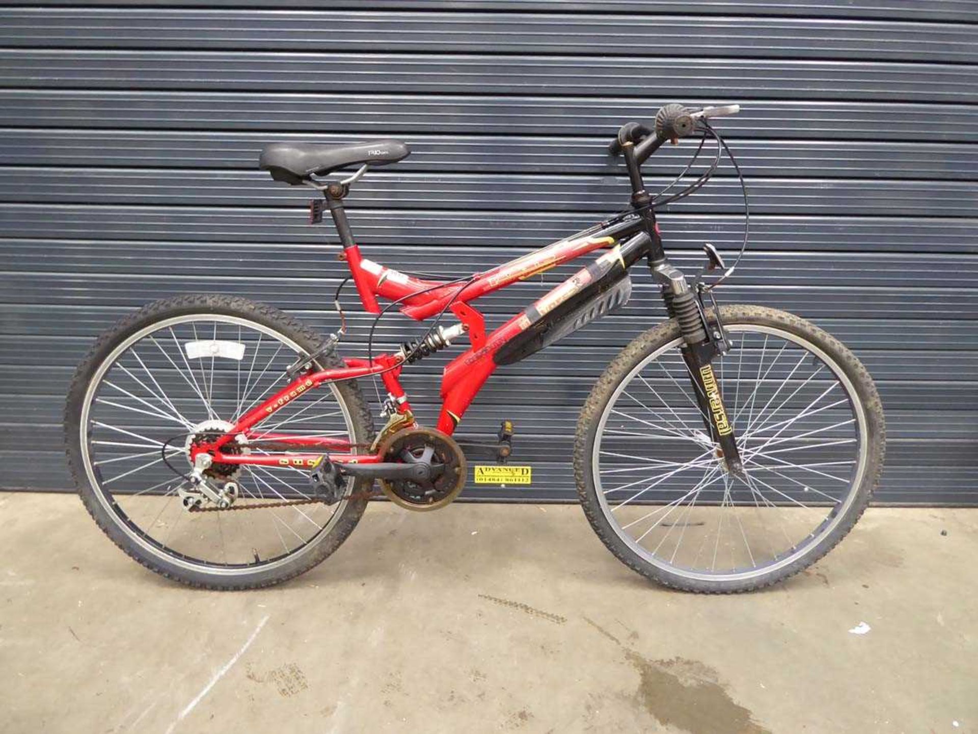 Red and yellow suspension junior mountain bike