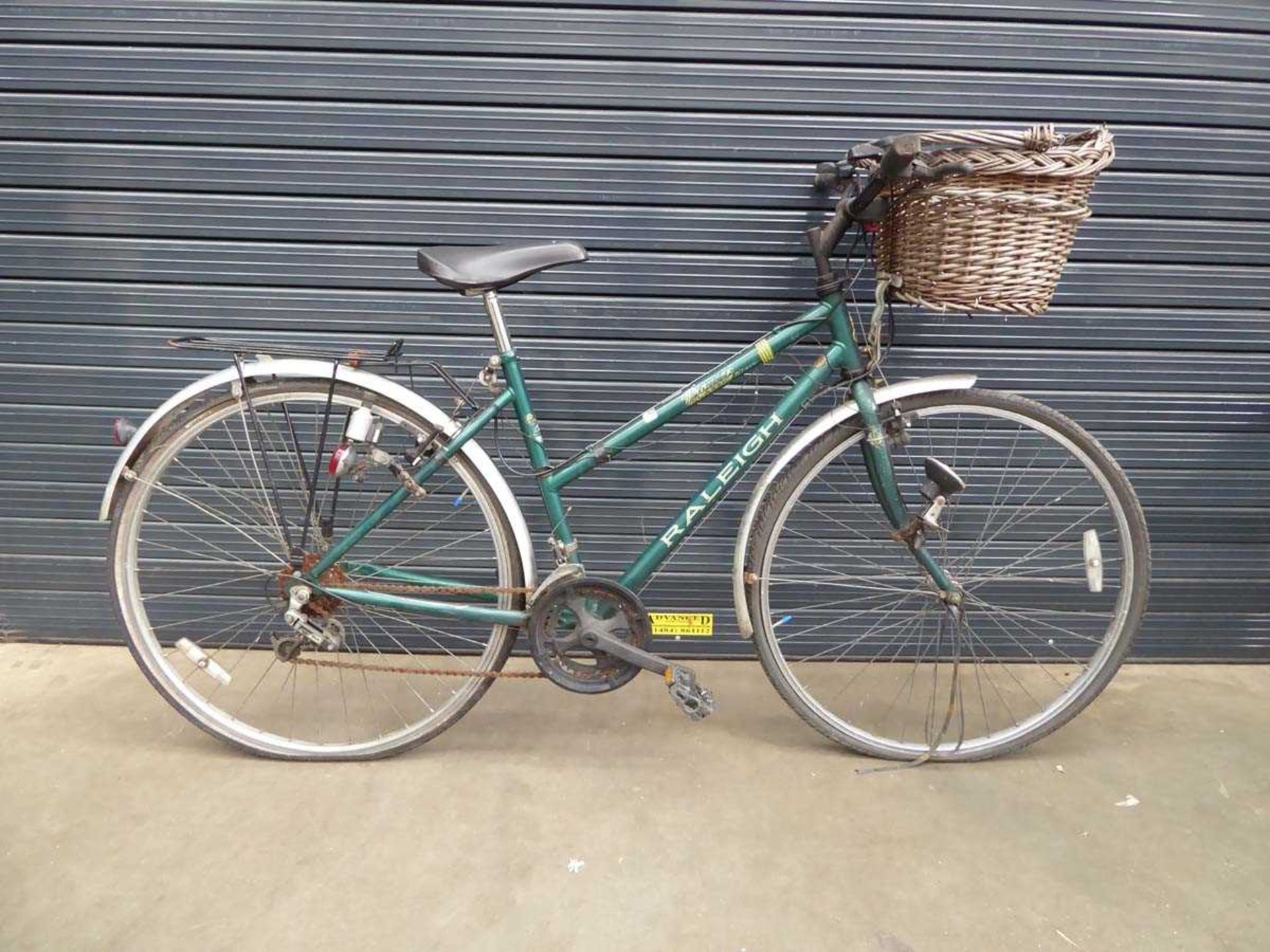 Raleigh green lady's bike with front basket