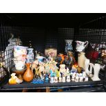 Cage containing thimbles, carnival glass animals, ornamental Labrador, candlestick, biscuit