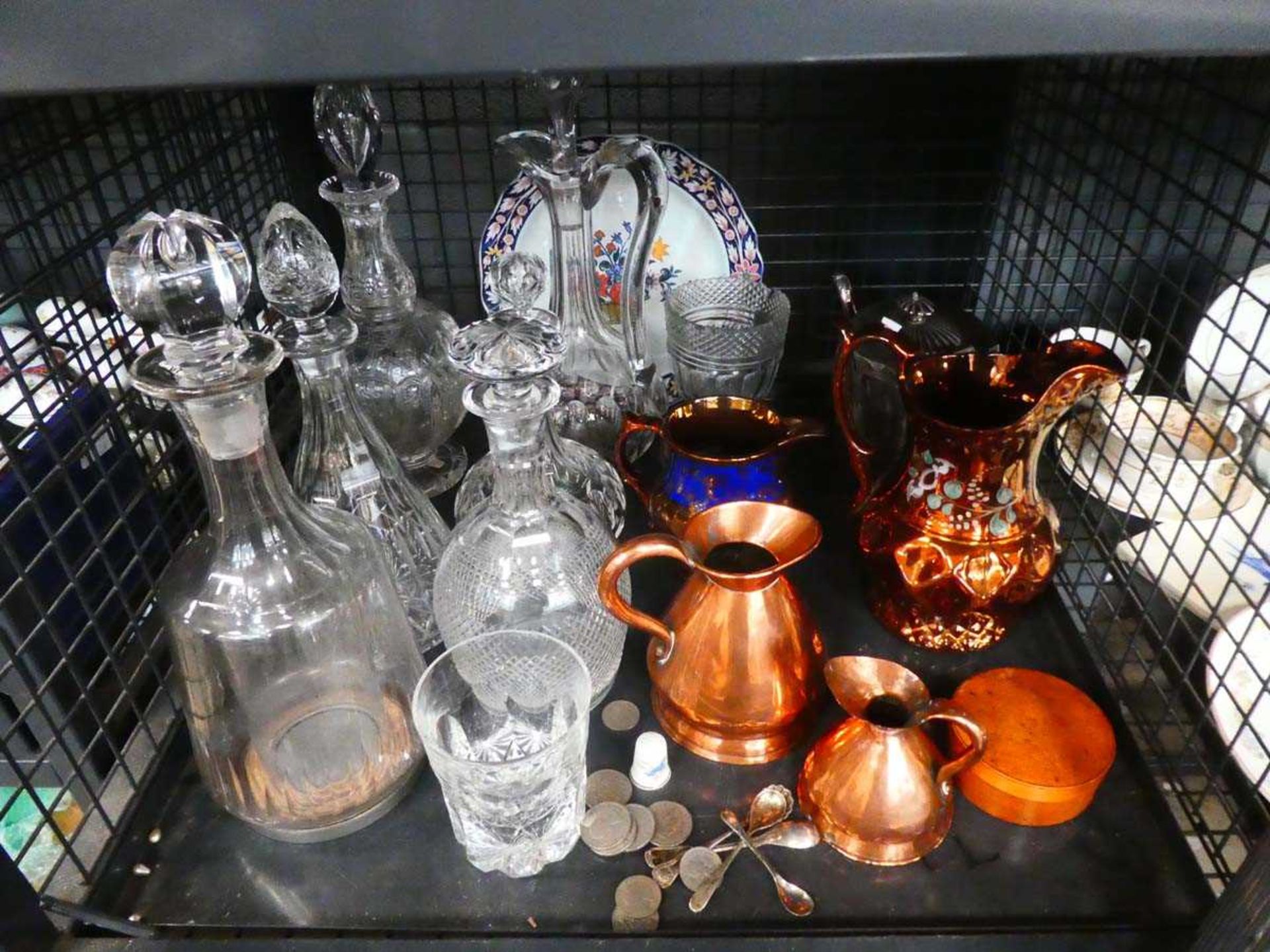 Cage containing loose coinage, silver plated mustard spoons, lustreware and decanters