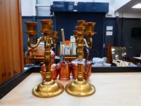 Quantity of copper and brassware to include a miniature still, kettle, plus a pair of candlesticks