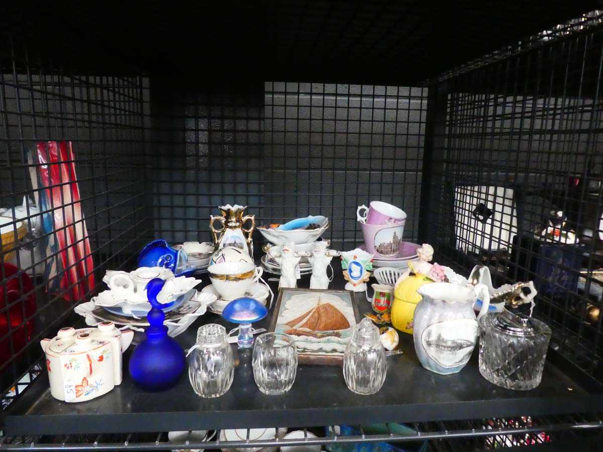 Cage containing ceramic figures, plus cups and saucers, cruet set, scent bottles, and crested ware
