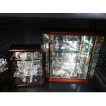 Cage containing collection of Swarovski crystals with display cases