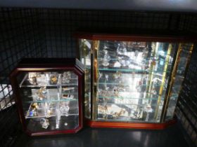 Cage containing collection of Swarovski crystals with display cases