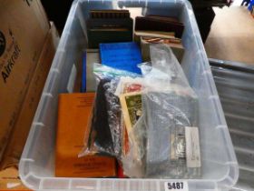 Box containing textbooks and novels
