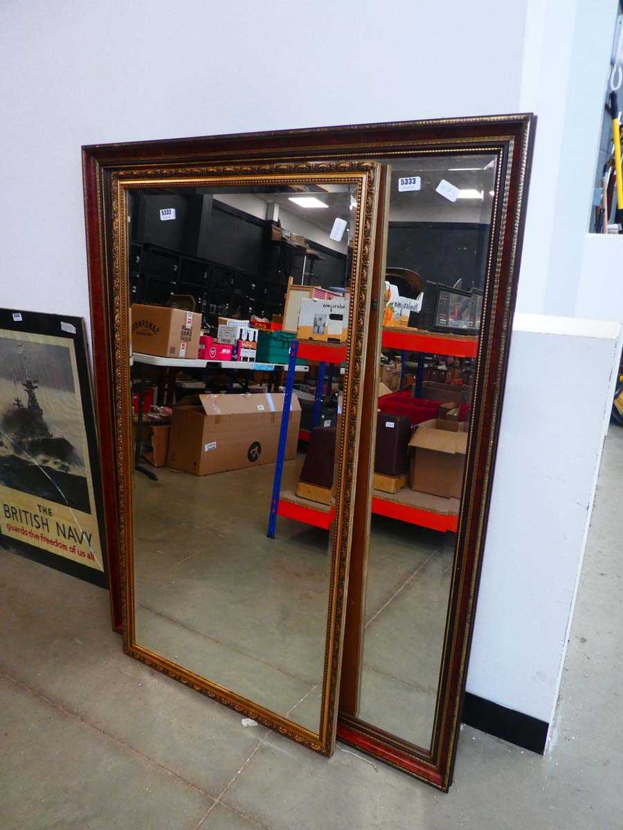Large rectangular bevelled mirror in faux walnut frame