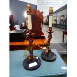 Pair of painted table lamps with acrobats to the column