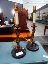 Pair of painted table lamps with acrobats to the column