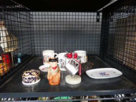 Cage containing commemorative mugs, small toby figure, opera glasses and miniature Eames style