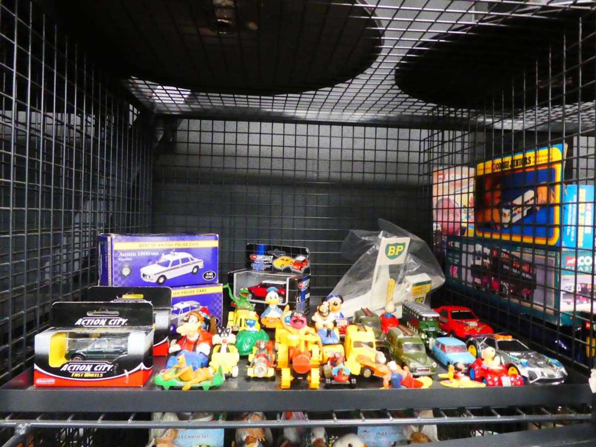 Cage containing boxed and loose die-cast vehicles