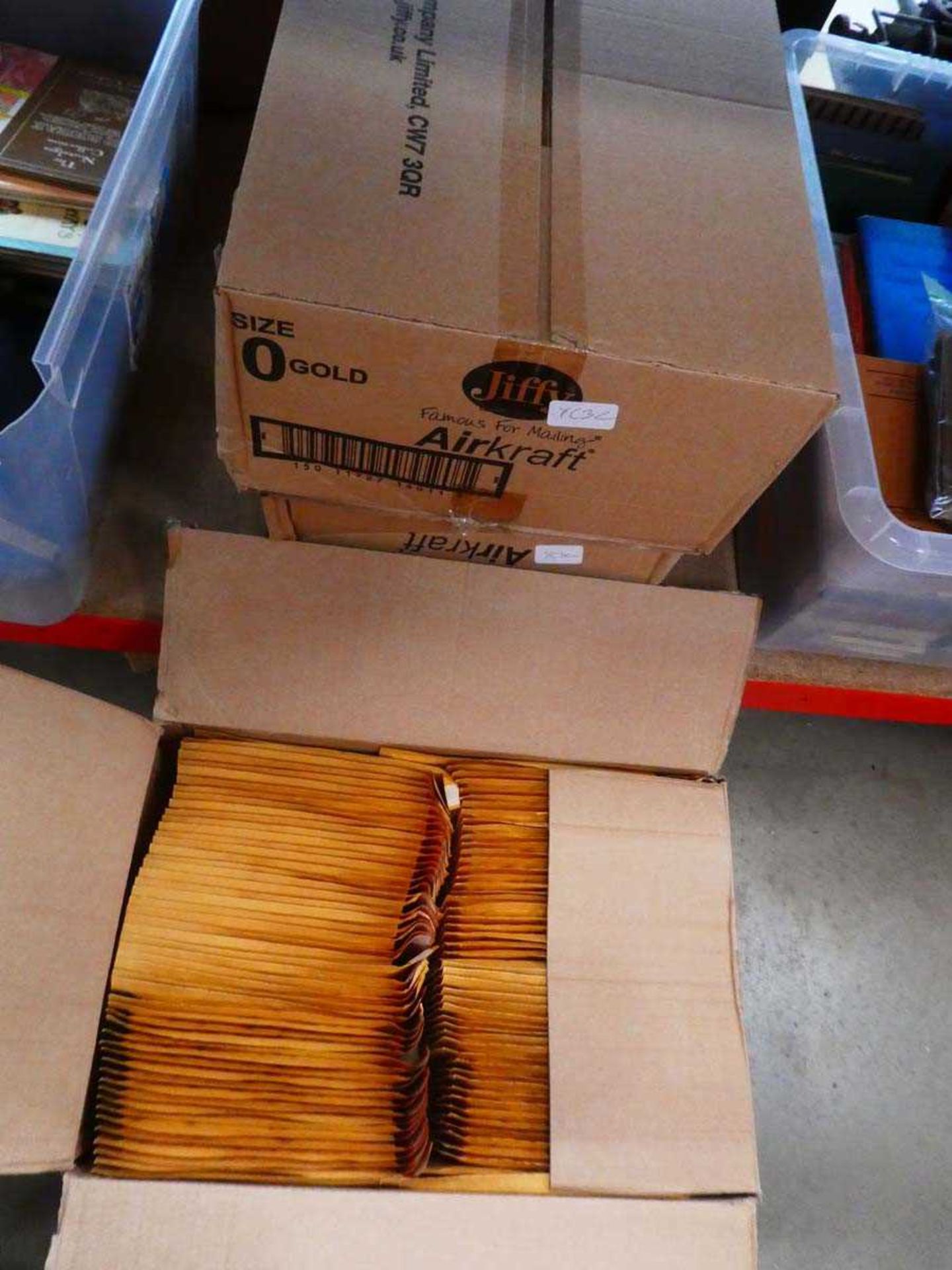 Three boxes containing jiffy packaging envelopes