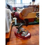 Resin figure of a cock pheasant in flight