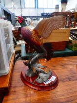 Resin figure of a cock pheasant in flight