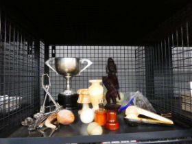 Cage containing silver plated trophy, carved East African figure, toast rack, loose cutlery, stone
