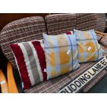 Five tartan and striped cushions
