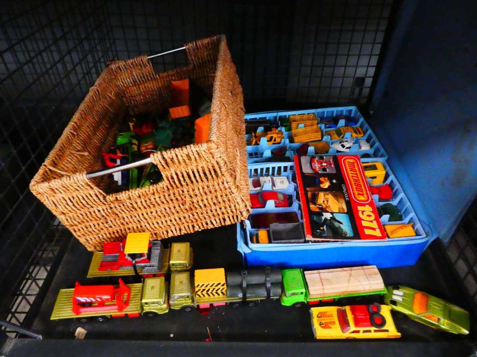 Cage containing matchbox die cast vehicles