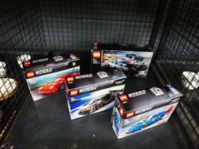 Cage containing 4 Lego racing car kits