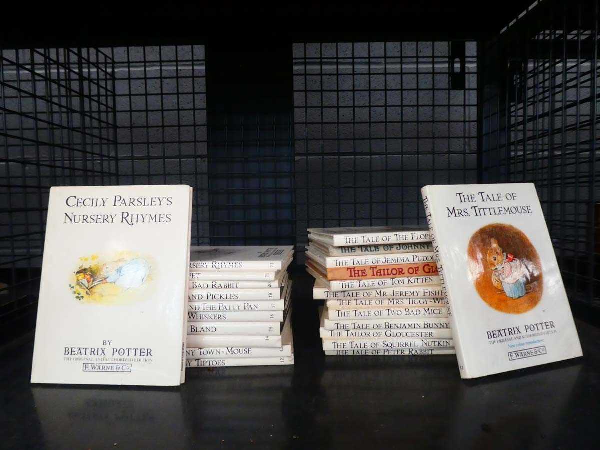 Cage containing Beatrix Potter books
