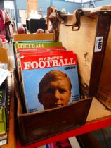 Vintage leather case with quantity of footballing annuals