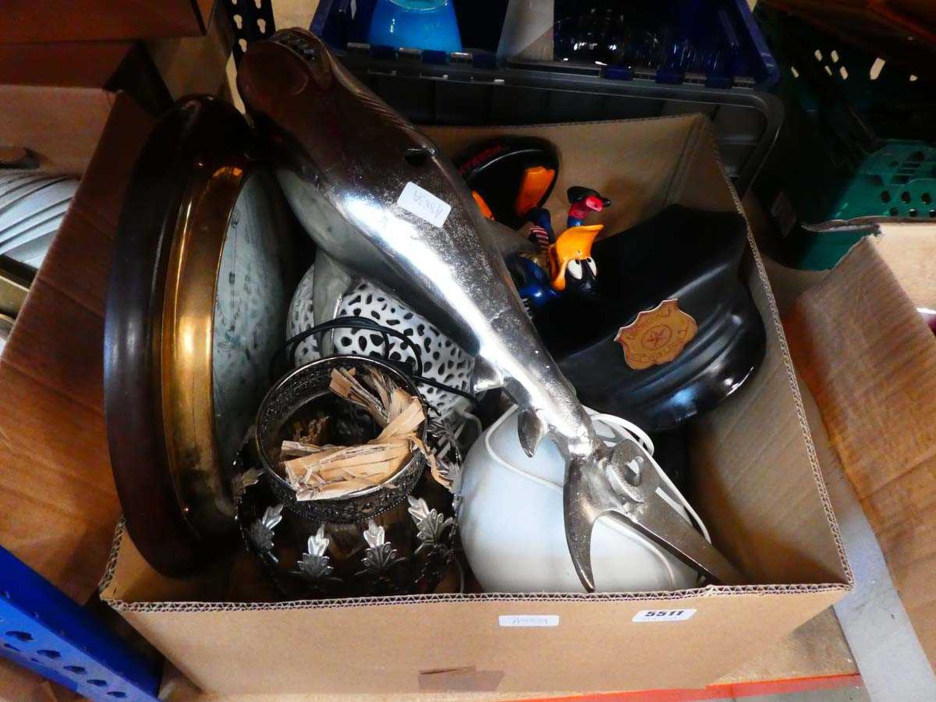 Box containing an ornamental shark, quartz wall clock, figure of Daffy Duck plus table lamps