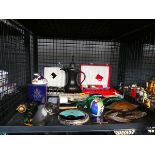 Cage containing boxed teaspoon sets, miniature brush, metal ornamental rhino and other figures