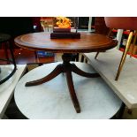 Circular reproduction coffee table with leather surface