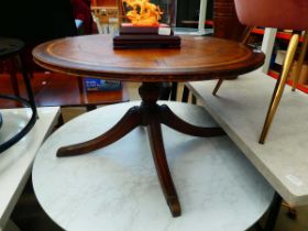 Circular reproduction coffee table with leather surface