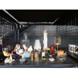 Cage containing ornamental bird figures, decanter, figure of Buddha, ornamental elephant, glassware,