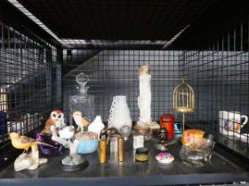 Cage containing ornamental bird figures, decanter, figure of Buddha, ornamental elephant, glassware,