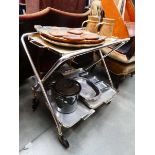 1950's 2 tier tea trolley with a quantity of painted wooden serving trays, coasters plus stainless