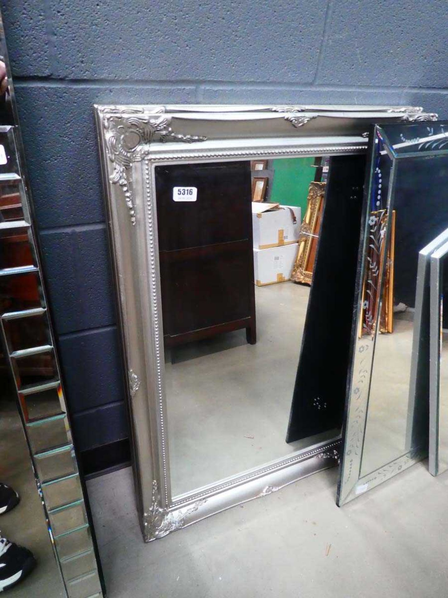 Pair of rectangular bevelled mirror in silver frames