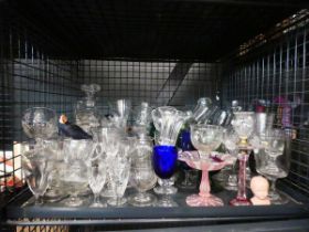 Cage containing ornamental figure, wine and sherry glasses