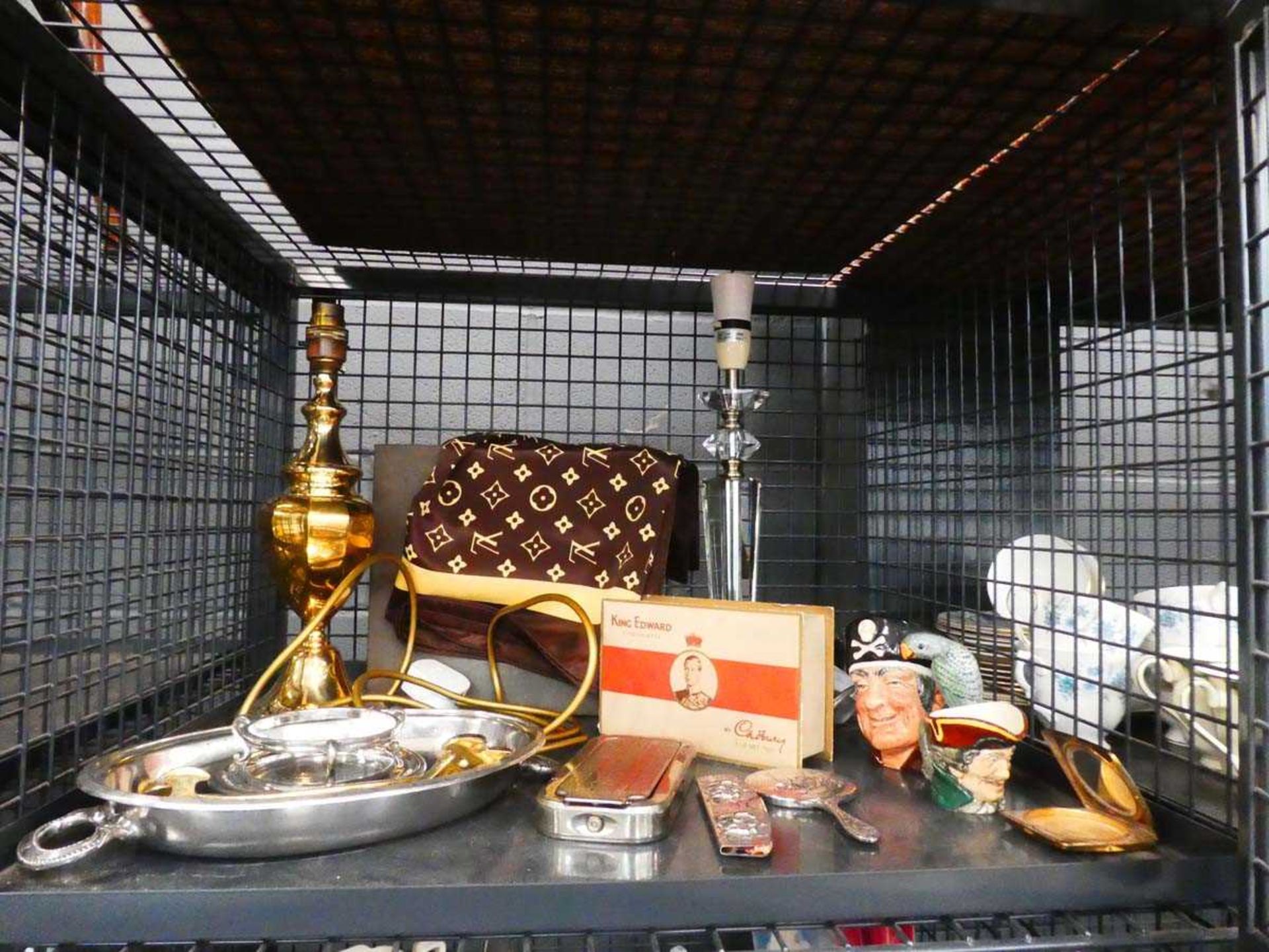 Cage containing table lamps, razor blade, miniature silver plated mirror, character jug and