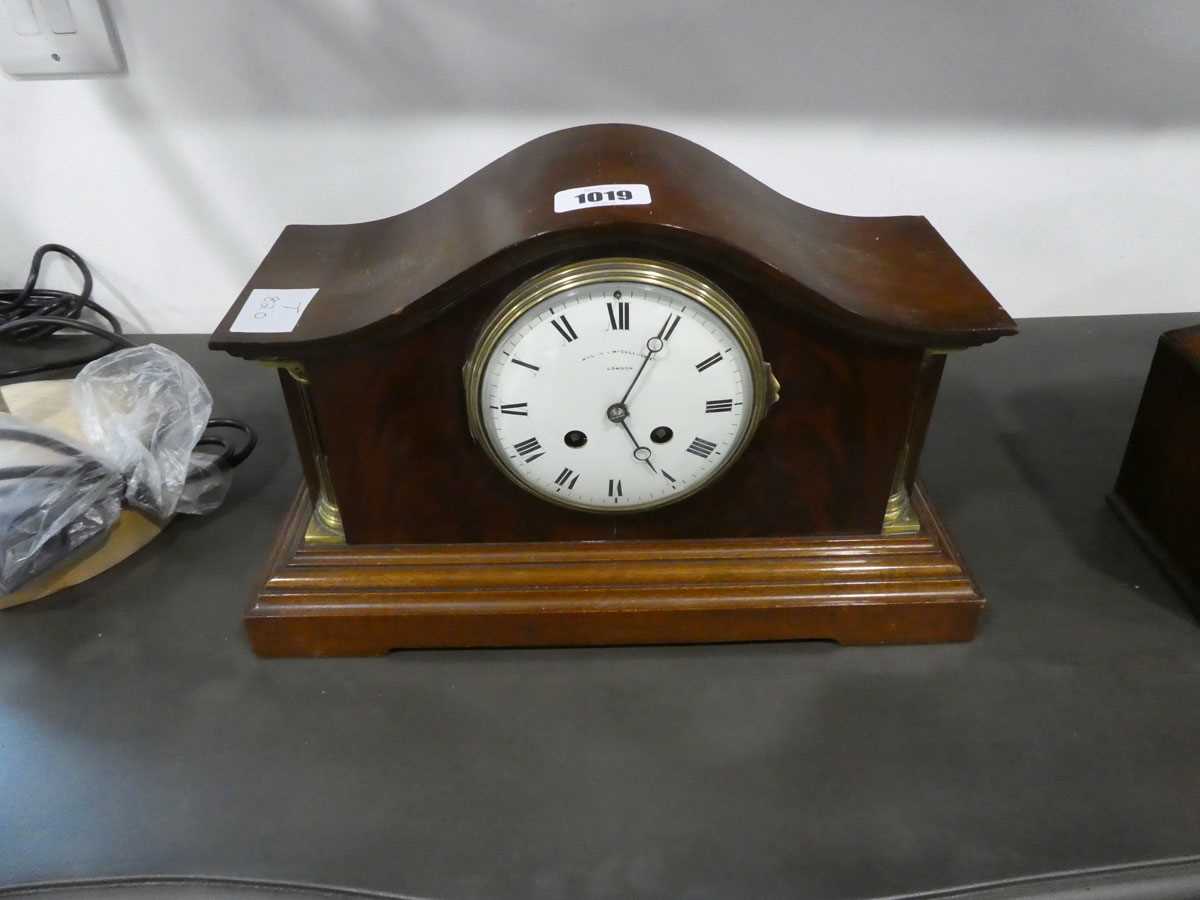 Wooden cased overmantel clock with decorative gold column inserts