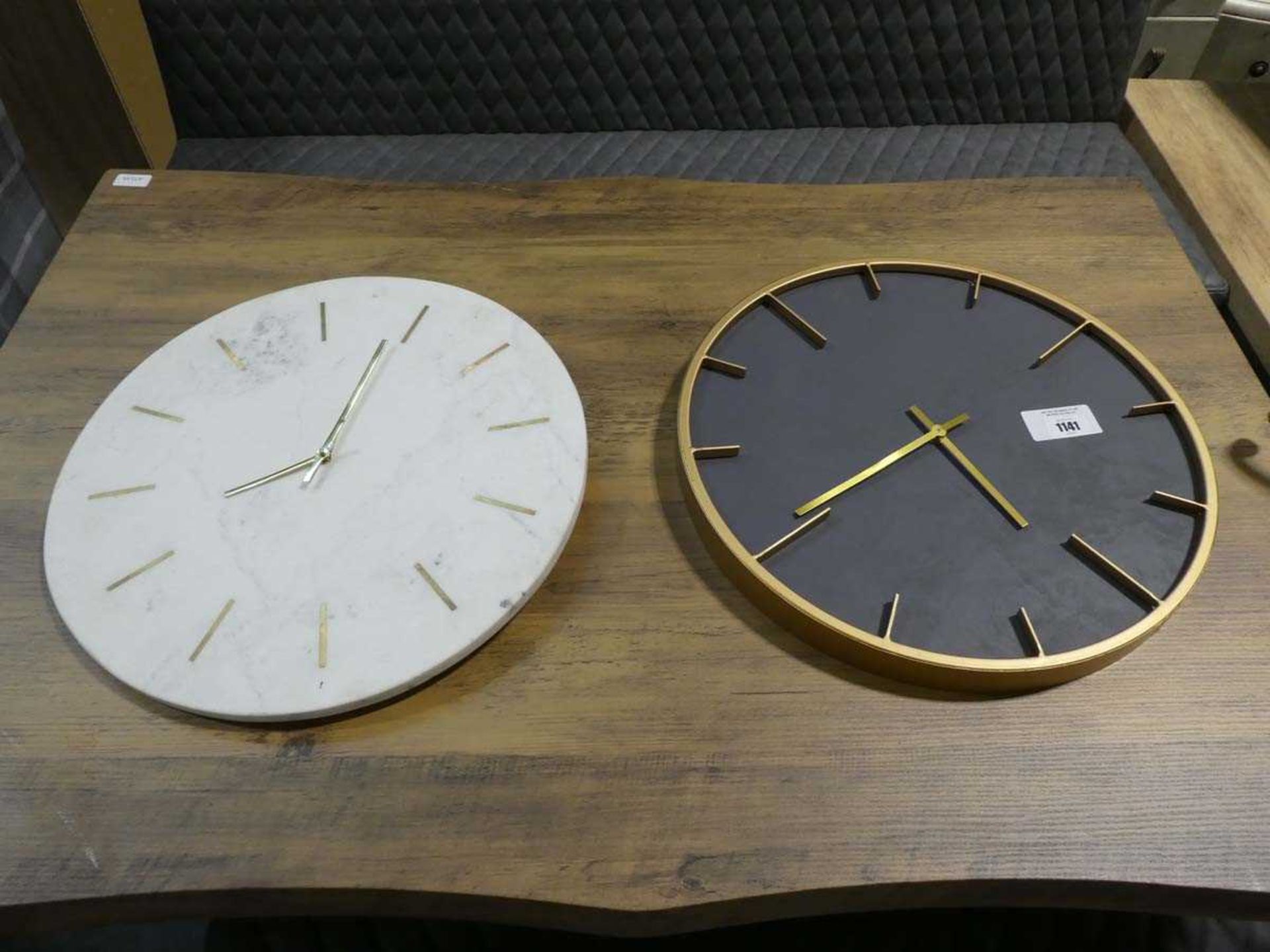 +VAT Black and gold coloured wall clock together with white and gold marble effect wall clock