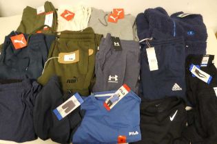 +VAT Approx. 14 items of branded sportswear incl. Champion, Puma, Under Armour, Adidas, Nike,