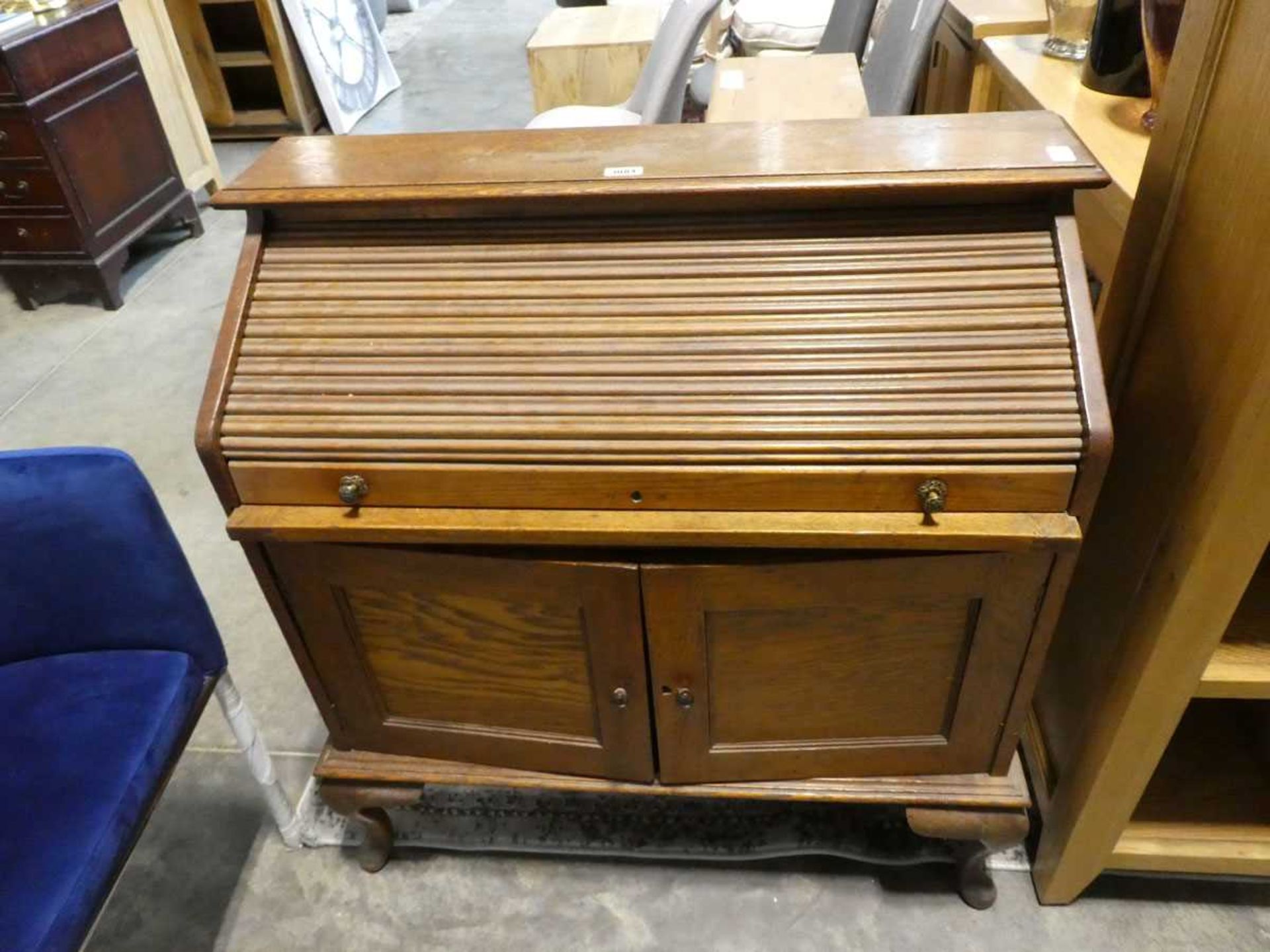 Oak roll top desk with 2 doors storage below