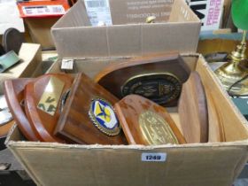 2 boxes containing various wall plaques to include FBI National Academy, military air lift, etc