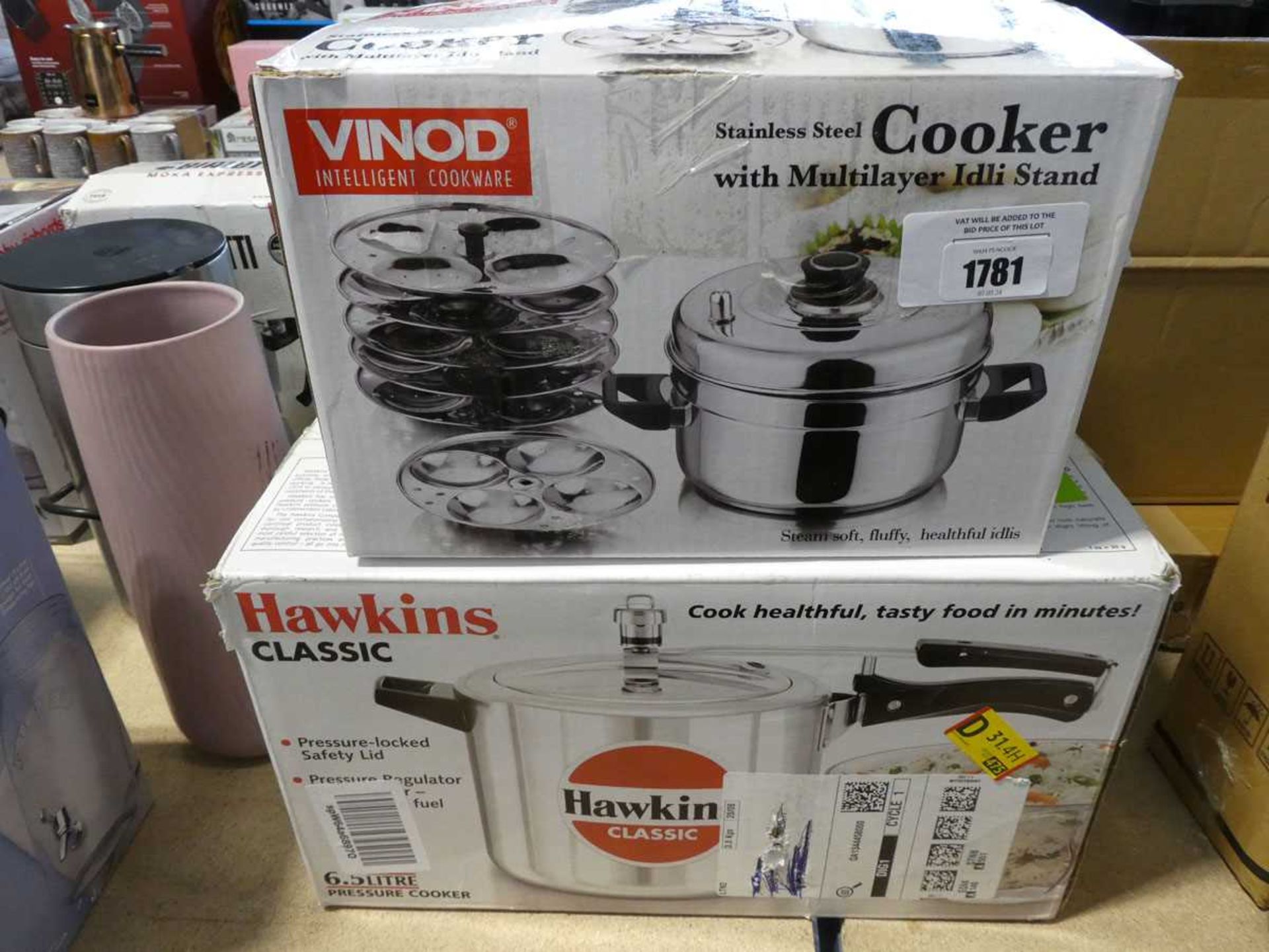 +VAT Vinod stainless steel cooker with multilayer stand, together with a Hawkins Classic pressure